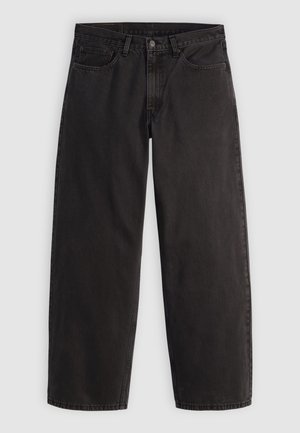 Črne ravne kavbojke iz jeansa s petimi žepi in zankami za pas, položene na ravno površino z enostavnim svetlim ozadjem.