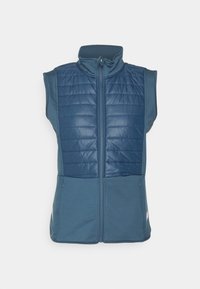 Ärm-lös väst i mörkblått med en fluffig, isolerad framsida och släta sidor. Dragkedjestängning och dubbla sidofickor.