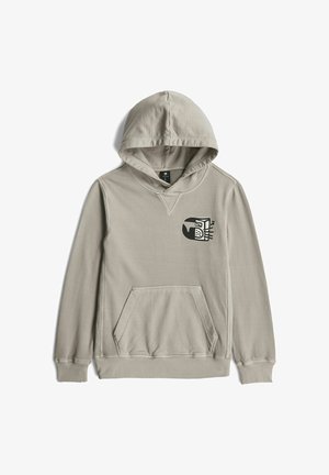 Sweat à capuche gris clair avec poche avant et petit motif noir d'une personne portant un casque sur la poitrine.