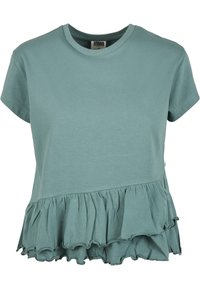 Teal kortärmad t-shirt i bomull med en volangkant och rund hals. Slät textur med en avslappnad passform.