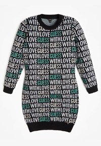 Pletené šaty s černým podkladem a bílým a tyrkysovým nápisem „S LÁSKOU GUESS“. Kulatý výstřih a dlouhé rukávy, strukturovaná tkanina.
