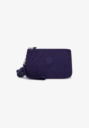 Dark purple rectangular wristlet pouch with zipper closure, circular logo patch, and a small plush keychain attached.