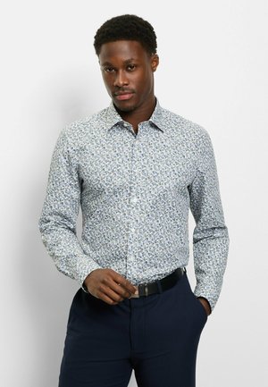 Long-sleeve shirt in light blue with a floral print in darker blue and green. Features a classic collar and button-down front.