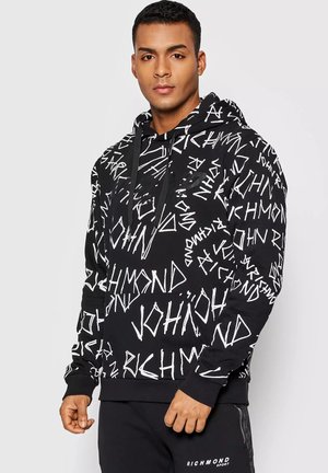 Felpa nera con cappuccio e motivi testuali astratti bianchi. Dotata di tasca a marsupio, polsini a costine e orlo per una vestibilità aderente.
