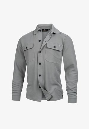 Light gray long-sleeve button-up shirt with two chest flap pockets and black buttons, collar, and a medium size label inside.