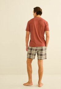 Next MOTIONFLEX COSY SET - Komplet pidžame - orange tan check