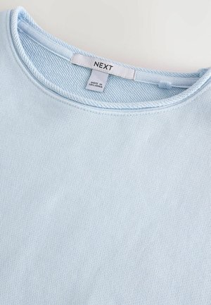 Lichtblauwe casual sweatshirt met een ronde hals, textuurstof en een label met "NEXT," gemaakt in Sri Lanka.