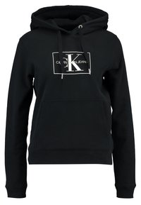 Sudadera negra con capucha hecha de mezcla de algodón, con un bolsillo frontal, puños acanalados y un logotipo gráfico "Calvin Klein Jeans" en blanco.