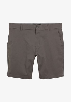 Szürke pamut sort gombos záródással, két elülső zsebbel és tiszta szélekkel. A textúrája sima, matt felülettel.