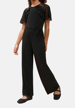 Combinaison noire avec manches courtes en dentelle, dotée d'un corsage ajusté, d'un pantalon à jambes larges et d'une taille à cordon pour un ajustement réglable.