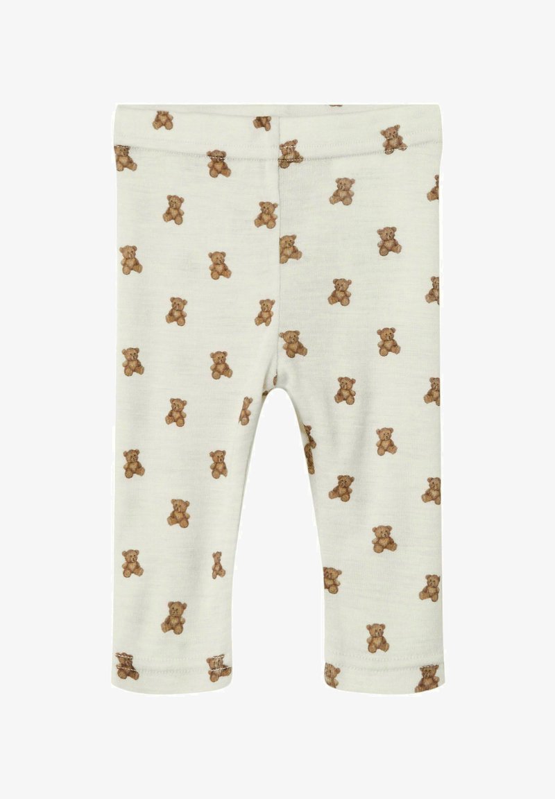 Bebe legice v kremni barvi s majhnimi odtisi rjavih medvedkov po celotni površini, z elastičnim pasom in ravno krojenimi nogami.