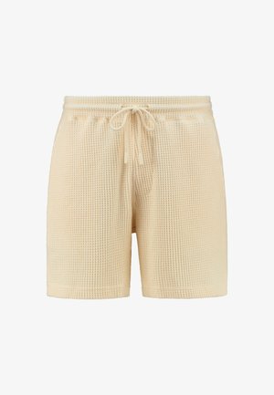 Beige Waffelstrick-Shorts mit elastischem Bund, Kordelzugverschluss und lockerer Passform. Einfaches Design ohne Muster oder zusätzliche Akzente.