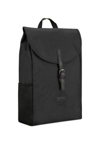 Black canvas backpack with a rounded flap, leather strap buckle closure, single side pocket, and a textured surface.