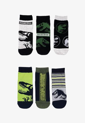 Six pairs of socks featuring dinosaur designs, in colors like black, green, and grey. Includes patterns and "Jurassic World" branding.