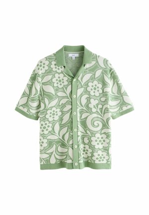 Short-sleeve button-up shirt with green collar and cuffs, featuring a green and white floral and leaf pattern.