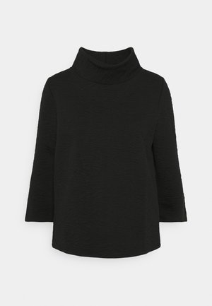 Black turtleneck top in textured fabric, featuring three-quarter sleeves and an oversized collar. Simple, straight-cut design.