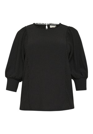 Blouse noire avec une finition texturée, encolure ronde et manches bouffantes. Présente une couture décorative sur le devant et le dos.