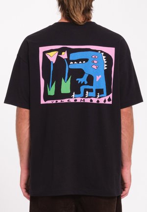 Black t-shirt featuring a colorful graphic on the back with a blue dinosaur, pink flowers, and green accents within a pink border.
