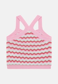 Pink patterned crop top with zigzag wave design in red, pink, and green, featuring a ribbed neckline and crossed back straps.
