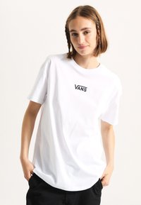 White cotton t-shirt with short sleeves, round neck, and embroidered "VANS" logo on the chest. Smooth texture and relaxed fit.