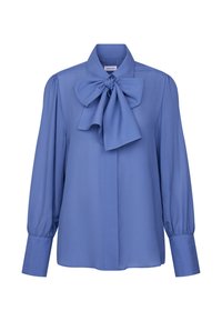Blouse bleue à manches longues avec un grand nœud noué au col et des poignets larges boutonnés, présentée sur un fond blanc.