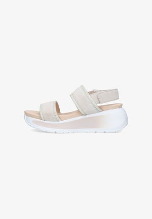 Sandalo beige open-toe con due ampie fasce e una cinghia alla caviglia su una spessa suola piattaforma bianca.