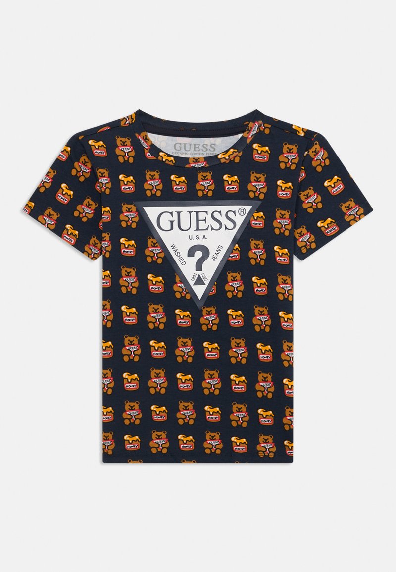 Jūros mėlynumo medvilninė marškinėliai su pakartotiniu meškos ir medaus indo raštu, centre esantis baltas trikampis "GUESS" logotipas. Trumpomis rankovėmis.
