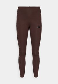 Καφέ κολάν από ελαστικό ύφασμα, με πλευρές σε σχεδίαση λεοπάρ και μικρό μαύρο λογότυπο στο μπροστινό αριστερό μηρό.