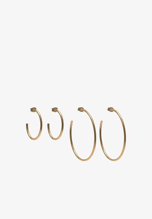 Creolen in Goldoptik in zwei Größen, mit glatter, glänzender Metalloberfläche und Klappverschlüssen. Minimalistische runde Form, ohne Verzierungen.