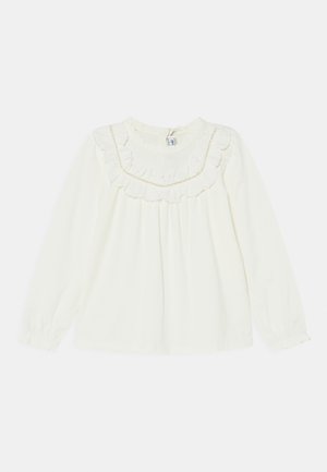 Weiße Langarmbluse mit gerüschtem Ausschnitt und Akzentbesatz. Weicher Stoff und lockere Passform, mit gerafftem Detail vorne und an den Manschetten.