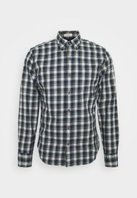 Chemise slim fit à manches longues avec un motif à carreaux vert, bleu marine et blanc et une poche sur la poitrine gauche.
