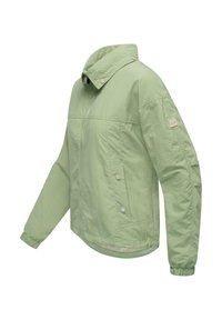 Light green, lightweight jacket with a high collar, zip closure, side pockets, and elastic cuffs; features a textured fabric and branded patch.