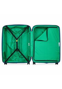 Valigia rigida con esterno blu navy, interno foderato in tessuto verde brillante. Presenta cinghie di compressione e un compartimento con zip su un lato.