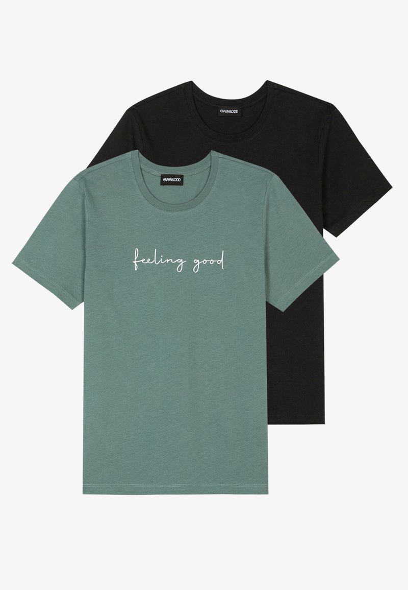Two short-sleeve t-shirts: one in teal with "feeling good" text, and one in black. Both have a classic crew neck and soft texture.