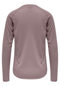Långärmad skjorta i mauve, tillverkad av lättviktsmaterial med en texturerad yta. Har raglanärmar och en nedre kant som är rundad.