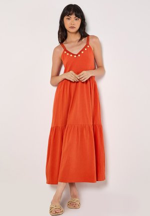 Maxi dress in bright orange fabric, featuring a V-neckline, decorative buttons along the straps, and a tiered skirt design.