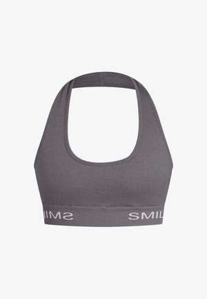 Harmaa urheiluliivi, jossa on pyöreä pääntie ja leveät olkaimet. Sisältää joustavan nauhan, jossa on valkoisella tekstillä "SMILE".