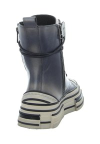 Grey leather boot with a high shaft, side zipper, and thick textured sole featuring horizontal stripes in dark and light colors.
