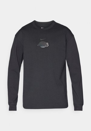 Schwarzes Langarm-T-Shirt aus weichem Stoff, mit einem glänzenden Logo-Detail auf der Brust. Rundhalsausschnitt und gerippte Bündchen sind enthalten.