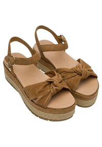 Hnědé semišové platformové sandály s uzlovou mašlí na špičce, polstrovanou stélkou a tkanými juteovými detaily na podrážce.
