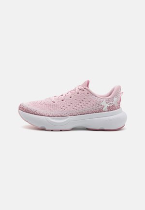 Pink athletic shoes with breathable mesh upper, textured details, and white rubber sole. Features laces and reinforced heel support.