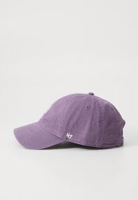 Purple cotton baseball cap with a curved brim, embroidered logo on the front, and '47' detail on the side. Smooth texture, casual design.