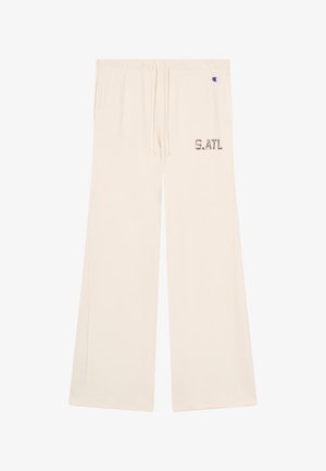 Cremewitte sweatpants met wijde pijpen, trekkoord in de taille, zijzakken, "S.ATL" print op de rechterdij, en klein Champion-logo vlak bij de taille.