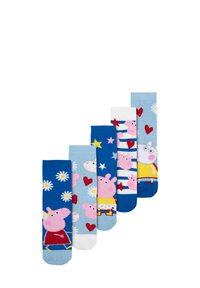 Cinque paia di calzini per bambini con vari design: sfondo blu con maialini dei cartoni, cuori, margherite e stelle in colori pastello.