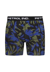 Miesten bokserit, joissa on musta vyötärö, jossa on teksti "PETROL IND." Kangas on koristeltu vihreällä ja sinisellä trooppisella lehtikuvioinnilla.