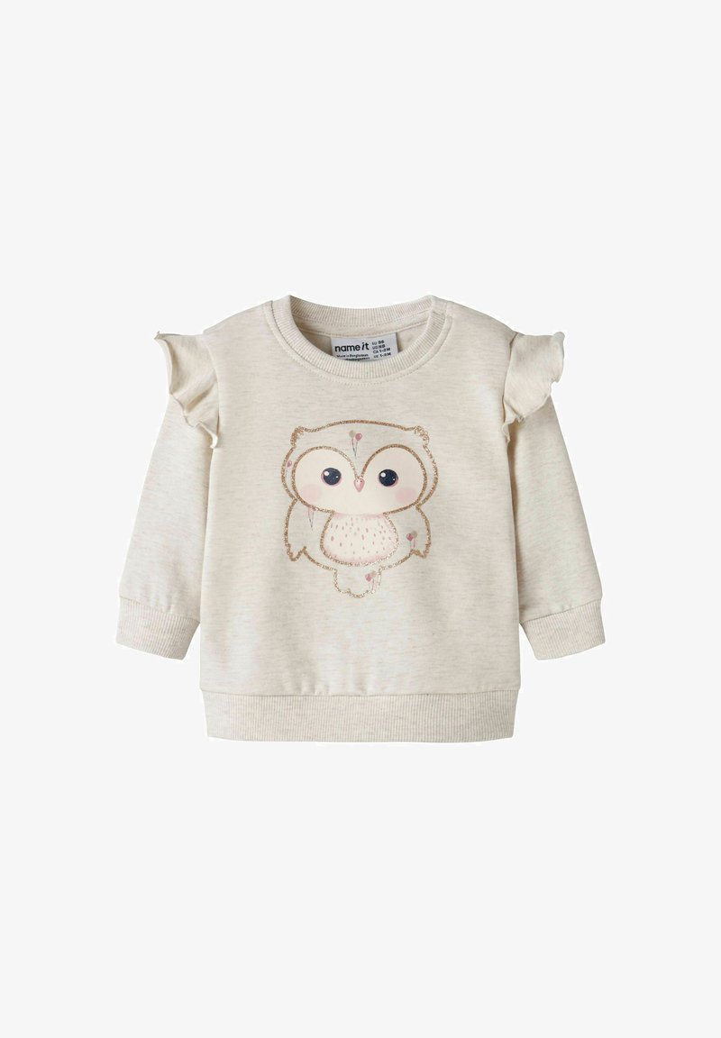 Sweat-shirt couleur crème pour tout-petit avec manches à volants aux épaules et grande illustration mignonne d'une chouette sur le devant.