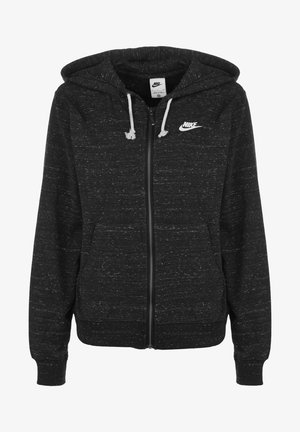 Zwarte hoodiejack met ritssluiting, witte gespetterde textuur, trekkoorden en een klein wit Nike-logo op de linkerborst. Voorzien van zakken aan de voorkant.