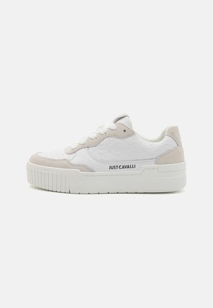 White and beige sneaker made of leather and suede, featuring a textured upper, lace closure, rounded toe, and chunky white sole.
