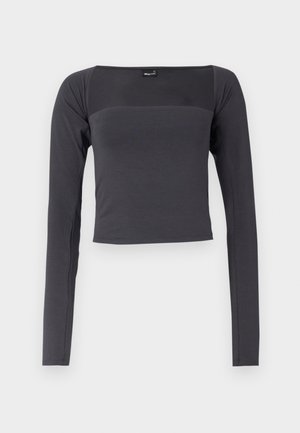 Long-sleeve, cropped top in dark gray fabric with a smooth texture. Features a square neckline and fitted design.