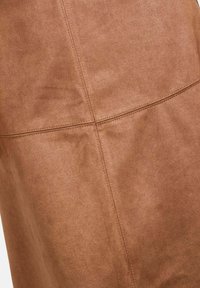 Brown faux suede fabric with a soft texture, featuring visible stitching lines and seams, creating a structured design.